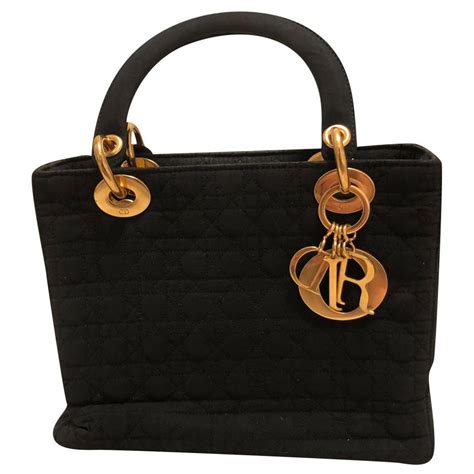 lady handbag by christian dior styled in black cannage canvas|lady dior handbags.